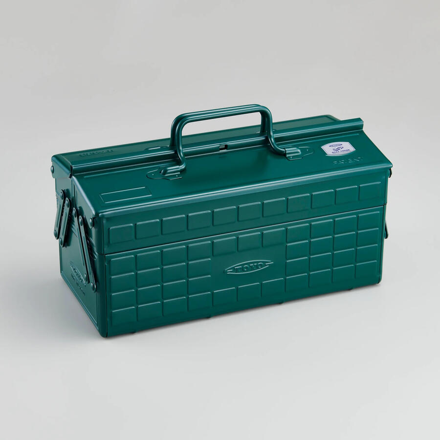 A steel toolbox in an antique green colour.