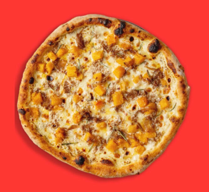 A pizza from above, on a red background, with white text below. The text reads "The Sausage Sting" followed by "A meaty take on our collab with Ben Lippett! Featuring a white base of crème fraîche and taleggio, topped with fior di latte mozzarella, pumpkin