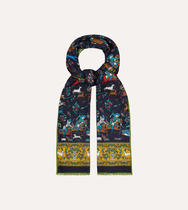 A navy scarf laid out in a loop, with an intricate print consisting of horseback archers, goats, flowers and other plants. It's accented with thick yellow stripes at either end, also detailed with printing.